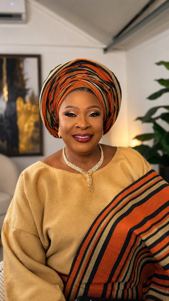 Gold and orange striped gele glam